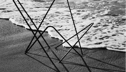 Carlos Herrera. Marco de silla de hierro en la playa, 1952. Gelatin silver - 20 x 16 inches.